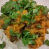 Butternut and chickpea curry with rice garnished with coriander